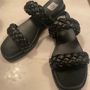 Black DV Dolce Vita braided slide sandal.